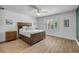 Bedroom with a view, plantation shutters, light fixture, and sleek decor at 6325 Palmas Bay Cir, Port Orange, FL 32127
