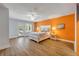 Spacious bedroom with wood floors, ceiling fan, and exterior access at 6325 Palmas Bay Cir, Port Orange, FL 32127