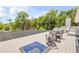 Stunning deck with outdoor seating, solar panels, and lush landscaping at 6325 Palmas Bay Cir, Port Orange, FL 32127