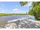 Waterfront dock featuring boat lift and steps down to the waterway at 6325 Palmas Bay Cir, Port Orange, FL 32127
