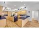 Spacious kitchen with custom wood cabinets, blue countertops, stainless steel appliances, and a large center island at 6325 Palmas Bay Cir, Port Orange, FL 32127