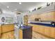 Open kitchen area with clear views to the breakfast nook, pool area, and the living room enhancing sociability at 6325 Palmas Bay Cir, Port Orange, FL 32127