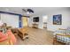 A cozy living room featuring nautical decorations and an orange couch at 6325 Palmas Bay Cir, Port Orange, FL 32127