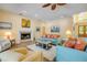 Comfortable living room boasts a fireplace, ample seating, and coastal decor creating a warm, inviting atmosphere at 6325 Palmas Bay Cir, Port Orange, FL 32127