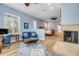 Comfortable living room with fireplace flows into main bedroom area for a spacious feel at 6325 Palmas Bay Cir, Port Orange, FL 32127