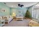 Stylish living room with a nautical theme, comfortable seating, and a beautiful Christmas tree at 6325 Palmas Bay Cir, Port Orange, FL 32127