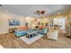 Spacious living area featuring comfortable sofas, tile flooring, and an open layout at 6325 Palmas Bay Cir, Port Orange, FL 32127