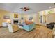 Open-concept living area with a fireplace, comfortable seating, and natural light at 6325 Palmas Bay Cir, Port Orange, FL 32127