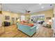 Bright and airy living room with tile flooring, comfortable seating, and sliding glass doors to the pool area at 6325 Palmas Bay Cir, Port Orange, FL 32127