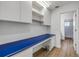 A functional office space with built-in shelves and a blue countertop at 6325 Palmas Bay Cir, Port Orange, FL 32127