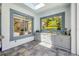 Outdoor kitchen with sink, prep area, storage, and views of the lush landscaping at 6325 Palmas Bay Cir, Port Orange, FL 32127