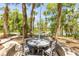 Picturesque outdoor seating area featuring a stone-enclosed patio and tranquil lake views at 6325 Palmas Bay Cir, Port Orange, FL 32127
