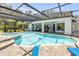 This is a shot of the in-ground pool from the home's backyard at 6325 Palmas Bay Cir, Port Orange, FL 32127