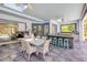 Well-lit sunroom boasts a dining area, outdoor kitchen, and comfortable seating at 6325 Palmas Bay Cir, Port Orange, FL 32127