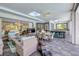Large sunroom with tile flooring, a dining table, and an outdoor kitchen with seating at 6325 Palmas Bay Cir, Port Orange, FL 32127