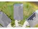 Aerial view of a well-manicured lawn, roof, and screened-in pool in the backyard at 6804 Forkmead Ln, Port Orange, FL 32128