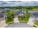 Aerial view of the property showcasing its location near a tranquil pond and community at 6804 Forkmead Ln, Port Orange, FL 32128