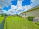 Manicured lawn with view of pond in backyard at 6804 Forkmead Ln, Port Orange, FL 32128