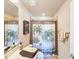 Charming bathroom with palm-themed shower curtain, tiled walls, and elegant fixtures, creating a relaxing retreat at 6804 Forkmead Ln, Port Orange, FL 32128