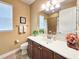 Bathroom with wooden vanity, decorative accents, and a shower-tub combo at 6804 Forkmead Ln, Port Orange, FL 32128