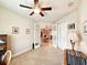 Versatile bedroom with French doors, ceiling fan, and closet, offering flexibility and comfort at 6804 Forkmead Ln, Port Orange, FL 32128