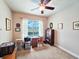 Bedroom featuring a window with a view, desk, and bookcase, creating a versatile and comfortable space at 6804 Forkmead Ln, Port Orange, FL 32128