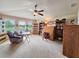 Spacious bonus room with ample seating and natural light, creating a comfortable and versatile living space at 6804 Forkmead Ln, Port Orange, FL 32128