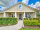 Inviting facade with manicured shrubs, a walkway to the front door and a beautiful entrance at 6804 Forkmead Ln, Port Orange, FL 32128