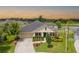 Charming front exterior with a well-manicured lawn, and a two car garage at 6804 Forkmead Ln, Port Orange, FL 32128