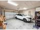 Spacious garage featuring a white Equinox and overhead storage racks at 6804 Forkmead Ln, Port Orange, FL 32128