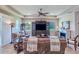 Comfortable living room with fireplace, built-in shelves, and large windows for natural light at 6804 Forkmead Ln, Port Orange, FL 32128