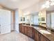 Spacious bathroom with double vanities, granite countertops, and tile flooring at 6804 Forkmead Ln, Port Orange, FL 32128