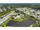 Serene aerial view of the neighborhood showcasing homes backing onto a lake at 684 Rochester Ct, New Smyrna Beach, FL 32168