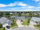 Aerial view of a well-maintained home situated on a beautiful lakefront property at 684 Rochester Ct, New Smyrna Beach, FL 32168