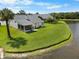 Spacious backyard with lush green lawn and waterfront views, perfect for outdoor activities at 684 Rochester Ct, New Smyrna Beach, FL 32168