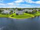 Lakeside home with a spacious backyard, perfect for outdoor activities and relaxation at 684 Rochester Ct, New Smyrna Beach, FL 32168