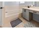 Bright bathroom features a tub, vanity, and tiled floor at 684 Rochester Ct, New Smyrna Beach, FL 32168