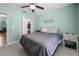 Comfortable bedroom with a ceiling fan and a closet, offering ample storage space at 684 Rochester Ct, New Smyrna Beach, FL 32168