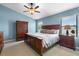 Comfortable bedroom with a ceiling fan, closet, and views to the water at 684 Rochester Ct, New Smyrna Beach, FL 32168