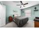 Cozy bedroom featuring carpet, a ceiling fan, and a window for natural light at 684 Rochester Ct, New Smyrna Beach, FL 32168