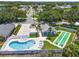 Aerial view of community pool and shuffleboard courts at 684 Rochester Ct, New Smyrna Beach, FL 32168