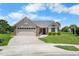 Attractive one-story home with a well-maintained front lawn and curb appeal at 684 Rochester Ct, New Smyrna Beach, FL 32168