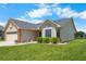 Well-kept home with a combination of brick and siding, complemented by green lawns at 684 Rochester Ct, New Smyrna Beach, FL 32168