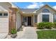 Welcoming front entrance with a decorative door, planters, and charming details at 684 Rochester Ct, New Smyrna Beach, FL 32168