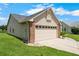 Attached two-car garage with an attractive design and functional layout at 684 Rochester Ct, New Smyrna Beach, FL 32168