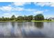 Picturesque lake view, ideal for relaxing and enjoying the waterfront scenery at 684 Rochester Ct, New Smyrna Beach, FL 32168