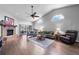 Bright living room boasts a fireplace, vaulted ceilings, and sliding glass doors to the lanai at 684 Rochester Ct, New Smyrna Beach, FL 32168