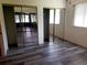 Bedroom featuring sliding closet doors and wood-look flooring at 714 Fox Tail Ct, New Smyrna Beach, FL 32168