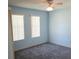 Cozy bedroom with carpeted floor, closet and natural light from two windows at 714 Fox Tail Ct, New Smyrna Beach, FL 32168