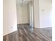 Open-concept entryway with luxury vinyl flooring and neutral walls at 714 Fox Tail Ct, New Smyrna Beach, FL 32168